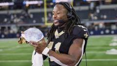 New Orleans Saints running back Alvin Kamara with an award after the game